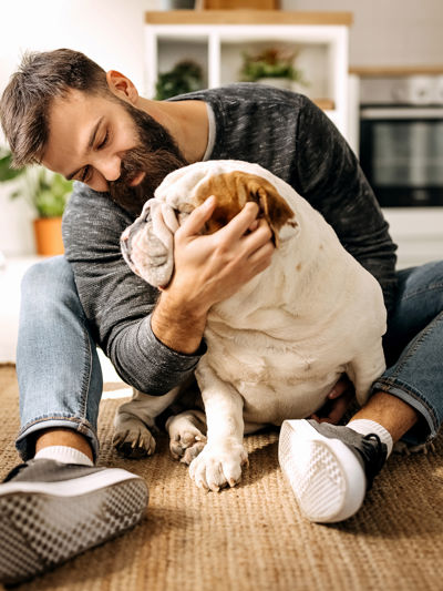 Man sitting on the floor with a dog.jpg