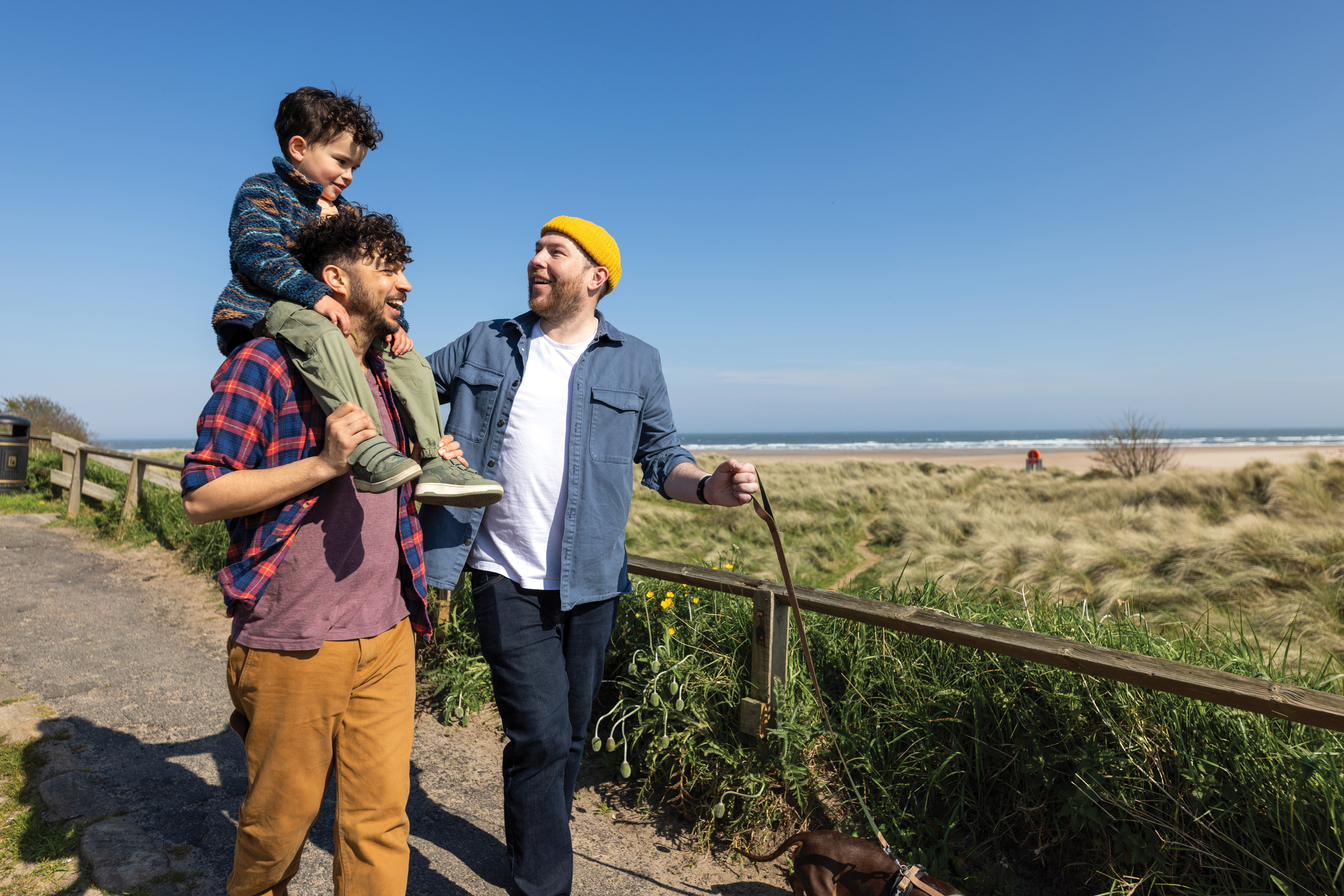 Family on a walk with child up on shoulders.jpg